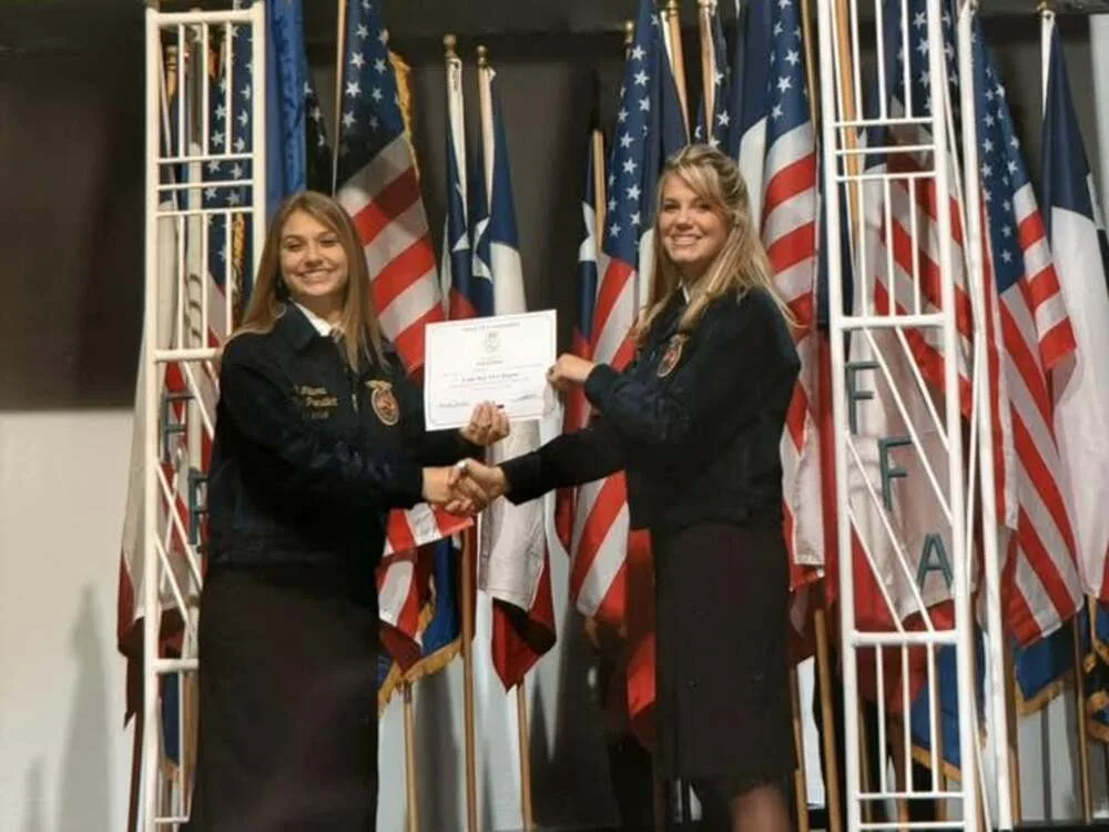 An FFA member receiving a Lone Star Degree certificate