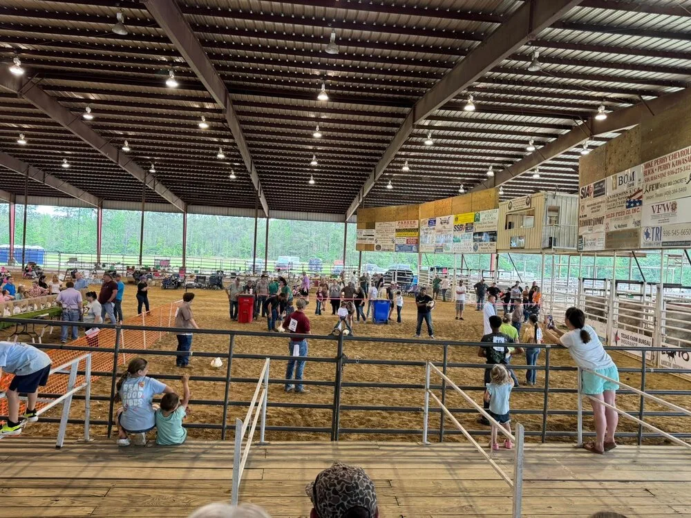 Wide view of the Sabine County Expo Center show arena, packed with exhibitors and spectators on show day
